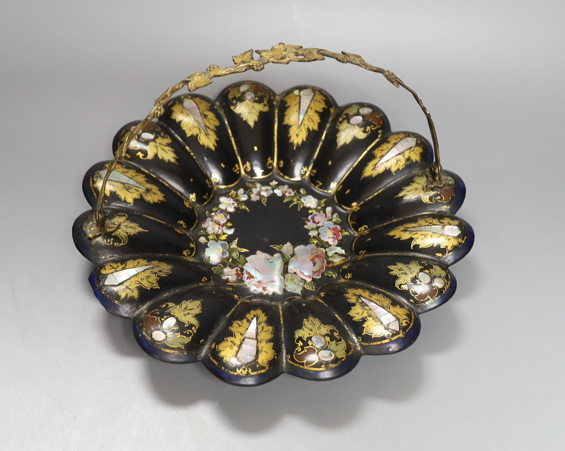 A Victorian Jennens & Bettridge papier-mâché basket with inlaid floral decoration and brass swivel handle - 27cm diameter